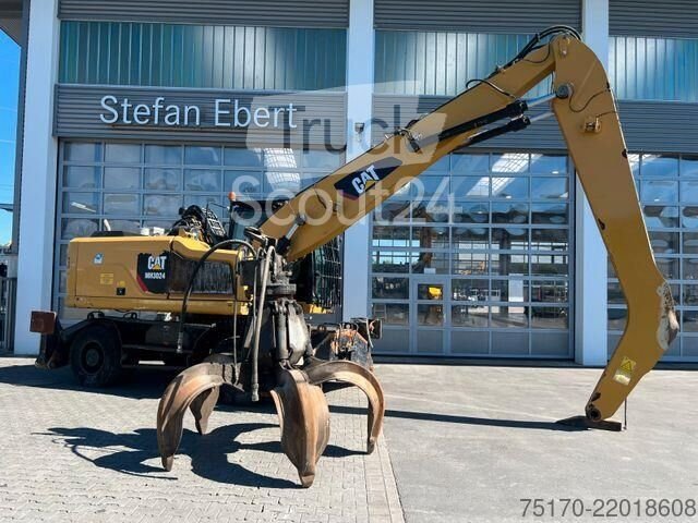 Použitý vykopávač kol CAT MH3024 / držák šrotu / 2019 / 9.082h