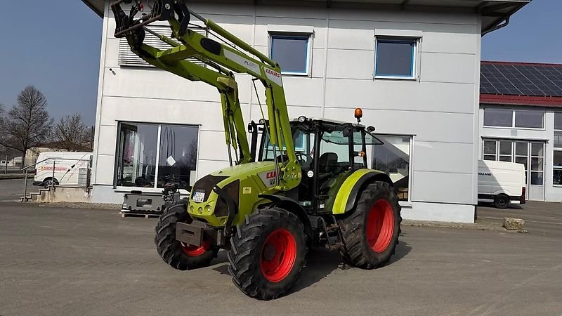 Claas Axos 310 with FL 80 front loader