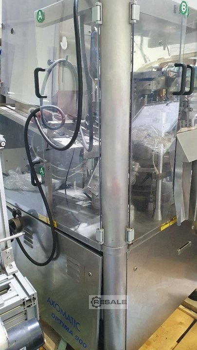 Maszyny do napełniania i uszczelniania rur kołnierzowych AXOMATIC Optima 900