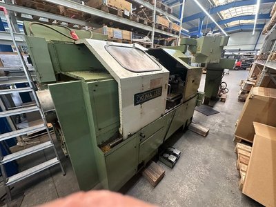 Токарный станок OKUMA LB15 с ЧПУ с чиповым конвейером