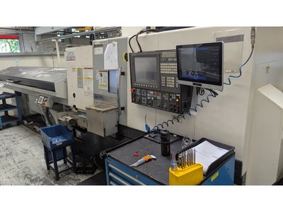 TATUNG OKUMA L300-MW CNC-Drehbank mit Stabzuführung