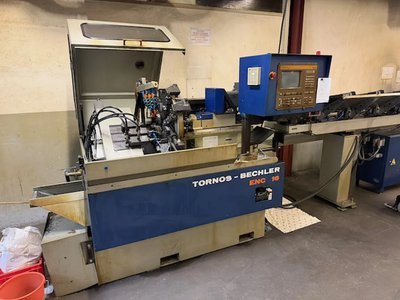 1990 Tornos ENC 16 – CNC-Drehbank mit Tornos-Stabzufuhr